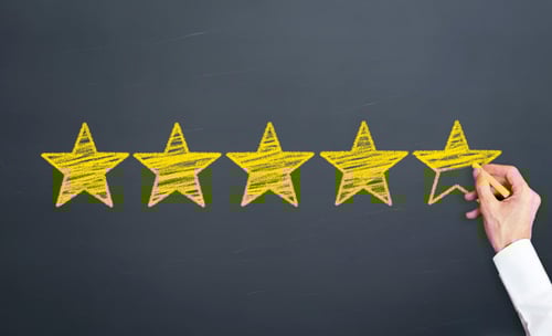 five yellow stars on blackboard
