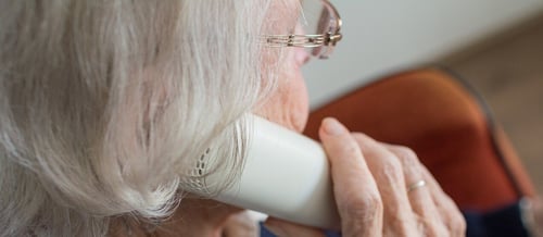 close up of senior woman talking on phone about her medicare plan