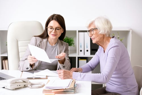 Insurance broker showing options to client
